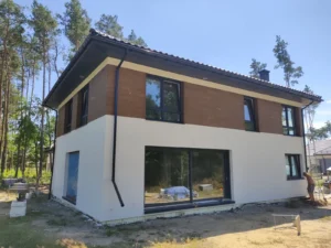 Domy energooszczędne Warszawa - dom piętrowy z dachem dwuspadowym i garażem